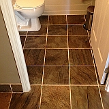 POLISHED SLATE CONDO BATHROOM FLOOR.